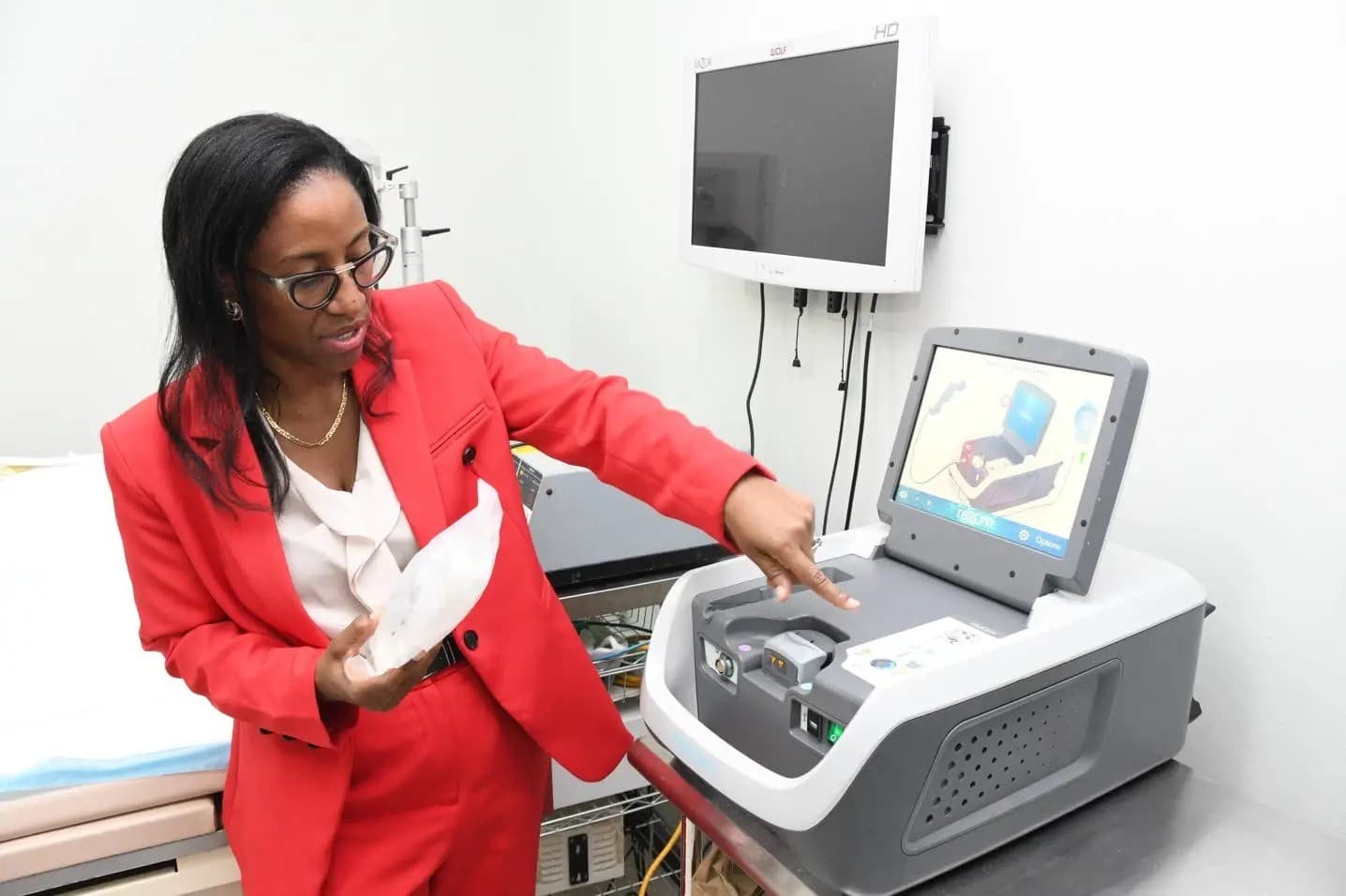 Dr. Belinda Morrison using advanced urology equipment