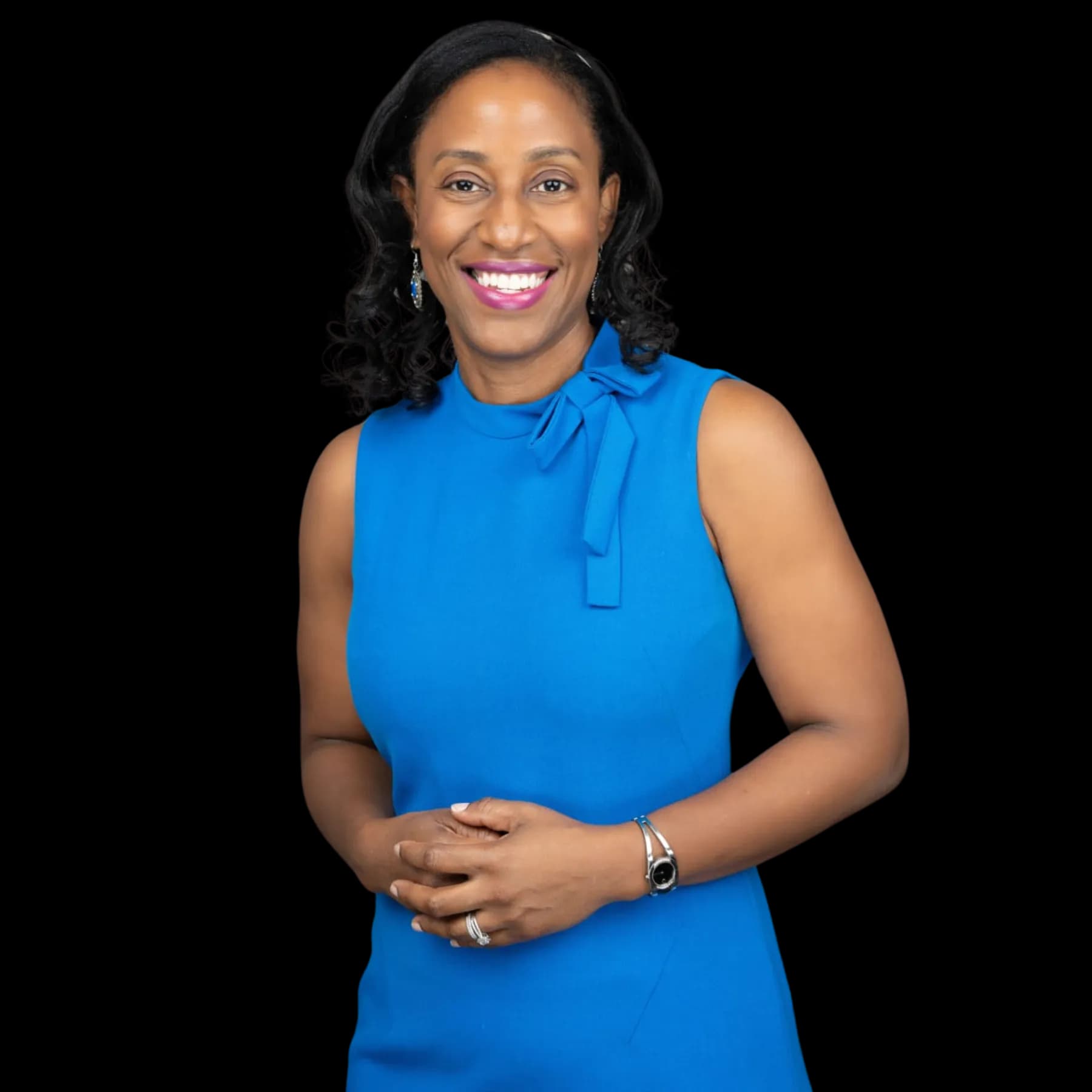 Dr. Belinda Morrison-Bidgen smiling in a blue dress